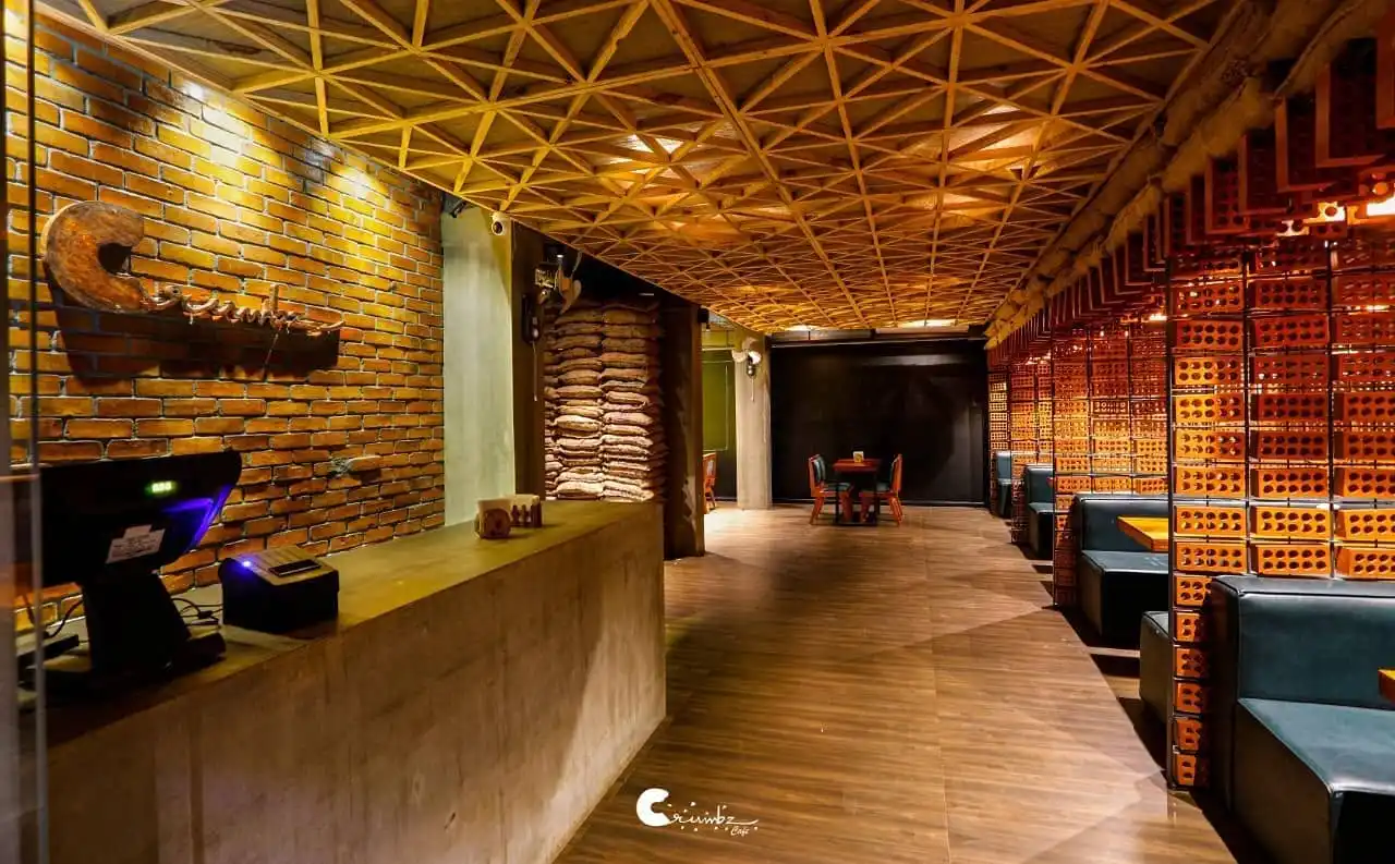 Best cafe in Thrissur for couples - cozy interior seating at Crumbz Cafe